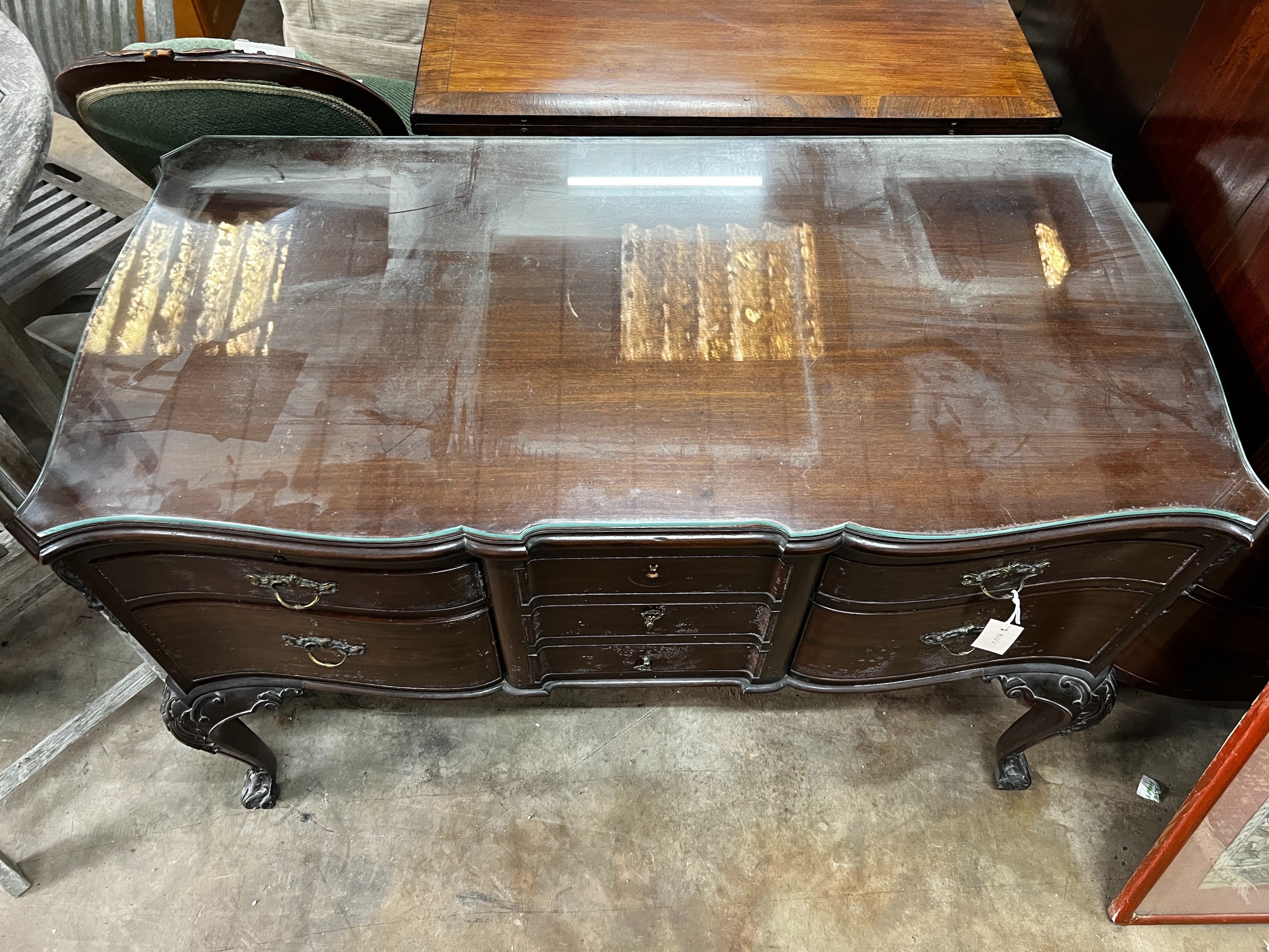 A Chippendale revival mahogany seven drawer dressing table, width 120cm, depth 59cm, height 79cm *Please note the sale commences at 9am.